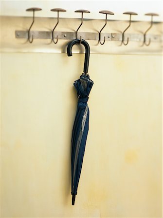 simsearch:600-03463202,k - Umbrella Hanging From Rack Foto de stock - Con derechos protegidos, Código: 700-00096962