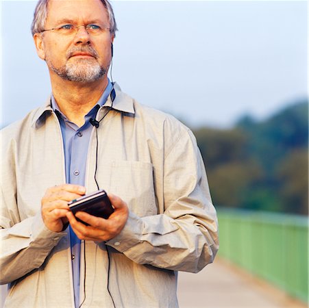 Homme avec organiseur électronique Photographie de stock - Rights-Managed, Code: 700-00097074