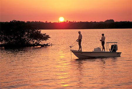 Two people fishing in the dark Stock Photos - Page 1 : Masterfile