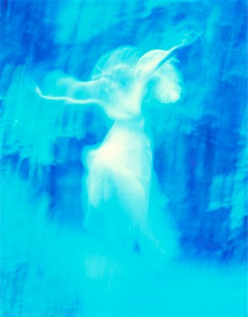 Blurred Woman Dressed as Angel in Forest Stock Photo - Rights-Managed, Code: 700-00097630
