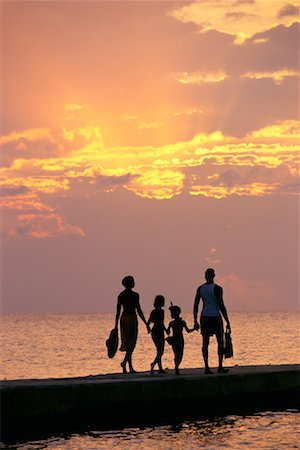 parent holding hands child silhouette - Silhouette of Family at Sunset Stock Photo - Rights-Managed, Code: 700-00098692