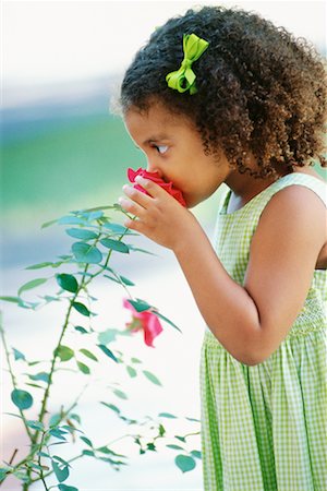 Image result for child smelling flowers