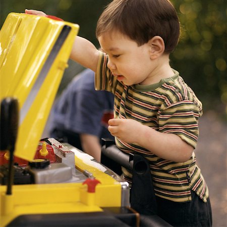 Child Fixing Car Stock Photo - Rights-Managed, Code: 700-00090237