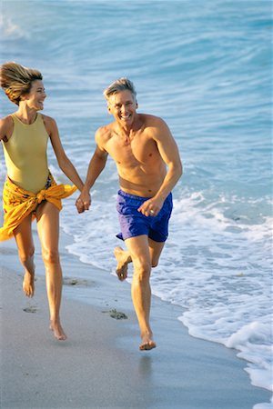Mature Couple Running on Beach Stock Photo - Rights-Managed, Code: 700-00090301