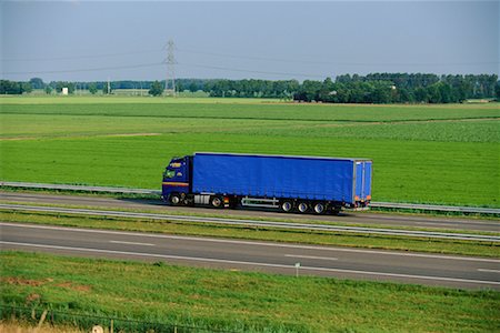 side view of a semi truck - Transport Truck on Highway Stock Photo - Rights-Managed, Code: 700-00090564