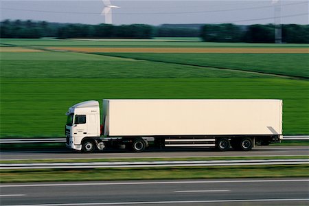 side view of a semi truck - Transport Truck on Highway Stock Photo - Rights-Managed, Code: 700-00090563