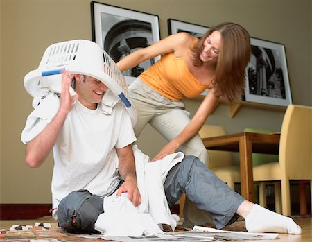 simsearch:700-00683268,k - Woman Dumping Laundry on Man Stock Photo - Rights-Managed, Code: 700-00090815
