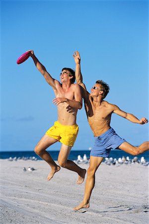 play frisbee in the beach - Young Men Playing Frisbee Stock Photo - Rights-Managed, Code: 700-00091709