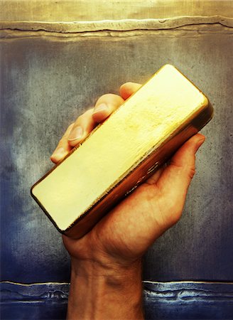 photo person holding gold brick - Hand Holding Gold Bar Stock Photo - Rights-Managed, Code: 700-00092673