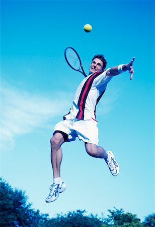 simsearch:400-04067347,k - Male Tennis Player in Mid-Air Foto de stock - Con derechos protegidos, Código: 700-00093131