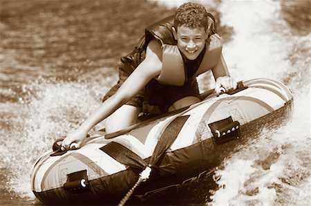 Boy Water Tubing Stock Photo - Rights-Managed, Code: 700-00093249