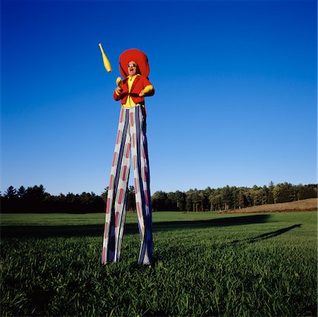 Man on Stilts Juggling Stock Photo - Rights-Managed, Code: 700-00093297