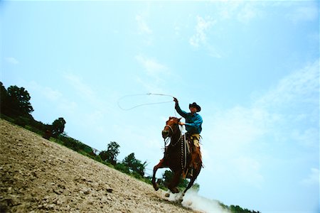 stati delle pianure - Man Riding Horse Oklahoma, USA Fotografie stock - Rights-Managed, Codice: 700-00093947