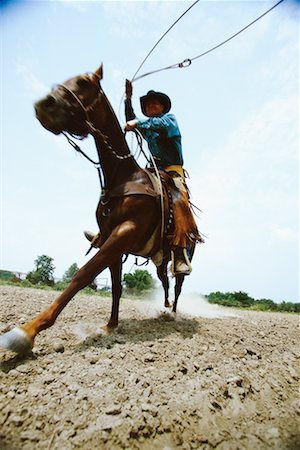 stati delle pianure - Man Riding Horse Oklahoma, USA Fotografie stock - Rights-Managed, Codice: 700-00093948