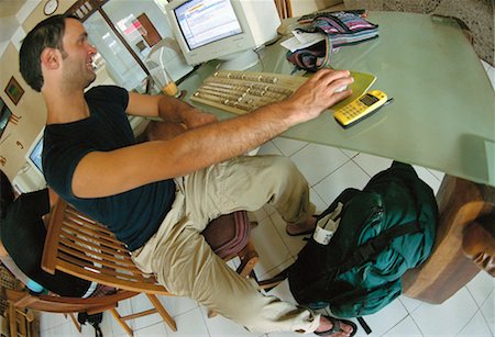 Man Sitting at Computer Foto de stock - Direito Controlado, Número: 700-00155312