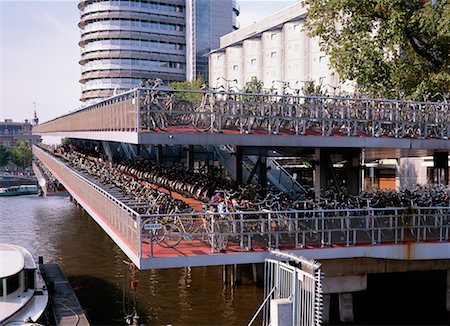 Rows of Bicycles by Railing Amsterdam, Holland Stock Photo - Rights-Managed, Code: 700-00155476