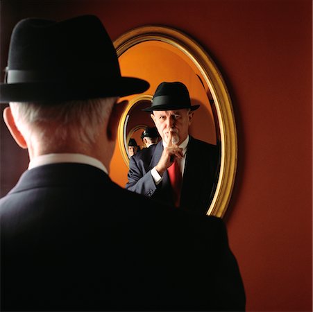 Businessman Looking in Mirror Fotografie stock - Rights-Managed, Codice: 700-00156602