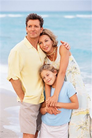 Portrait of Young Parents with Daughter on Beach Stock Photo - Rights-Managed, Code: 700-00157810