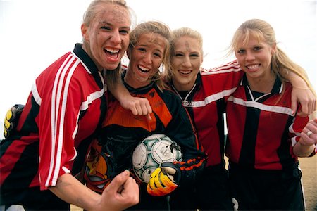 Portrait of Girls' Soccer Team in Mud Stock Photo - Rights-Managed, Code: 700-00158056