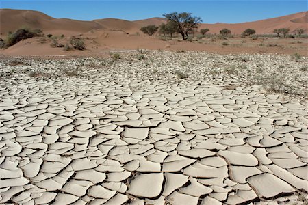 Cracked Mud in Desert Sossuvlei, Namibia South Africa Africa Foto de stock - Con derechos protegidos, Código: 700-00158338