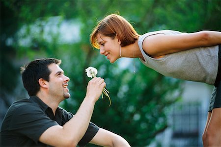 flower bending over - Man Giving Flower to Woman Stock Photo - Rights-Managed, Code: 700-00158479