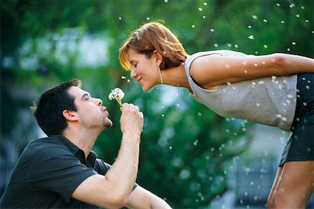 flower bending over - Man Giving Flower to Woman Stock Photo - Rights-Managed, Code: 700-00158480