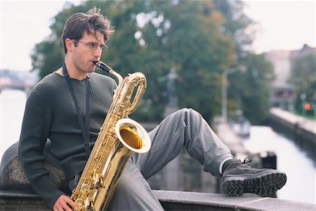 simsearch:700-00349990,k - Young Man Playing Saxophone in City Stock Photo - Rights-Managed, Code: 700-00158502