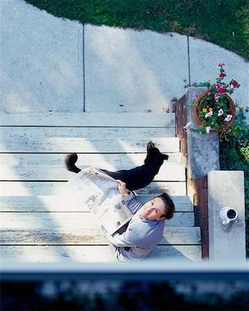 simsearch:700-00062758,k - Woman Reading Newspaper on Steps Stock Photo - Rights-Managed, Code: 700-00158917