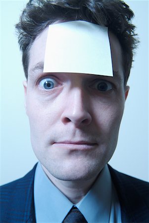 Businessman with Sticky Note On Forehead Stock Photo - Rights-Managed, Code: 700-00159018