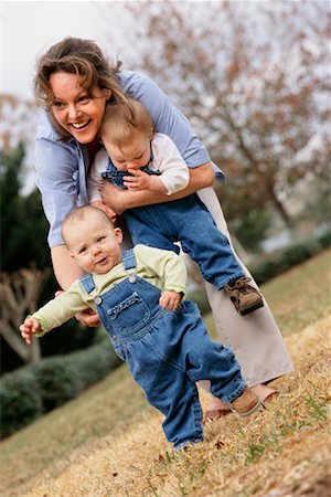 first steps mother - Mother and Twins Outdoors Stock Photo - Rights-Managed, Code: 700-00159346