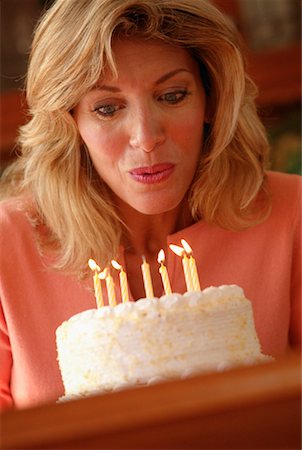 simsearch:600-00060932,k - Woman Blowing Out Candles Stock Photo - Rights-Managed, Code: 700-00159874