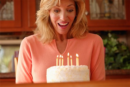 simsearch:600-00060932,k - Woman Blowing Out Candles Stock Photo - Rights-Managed, Code: 700-00159875