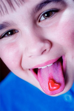 simsearch:600-00948150,k - Girl with Candy Heart on Tongue Stock Photo - Rights-Managed, Code: 700-00159997