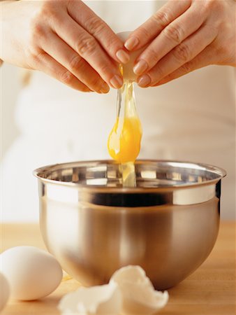 female pastry chef - Woman Cracking Egg Stock Photo - Rights-Managed, Code: 700-00150589