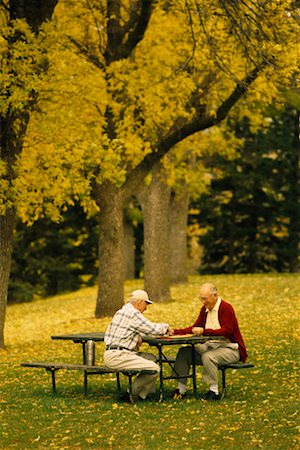 Two Mature Men Playing Chess Outdoors Stock Photo - Rights-Managed, Code: 700-00150668