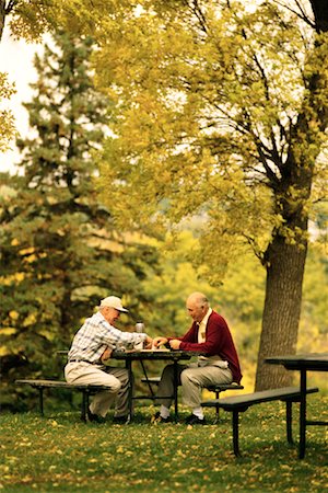 Two Mature Men Playing Chess Outdoors Stock Photo - Rights-Managed, Code: 700-00150669