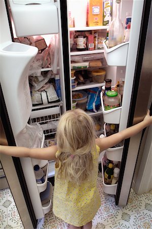 Girl Looking in Refrigerator Stock Photo - Rights-Managed, Code: 700-00150892