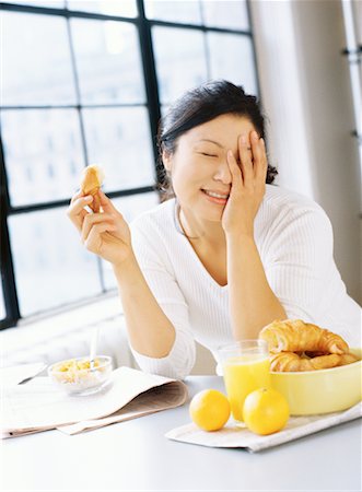 simsearch:700-00592522,k - Woman Eating Breakfast Stock Photo - Rights-Managed, Code: 700-00151259
