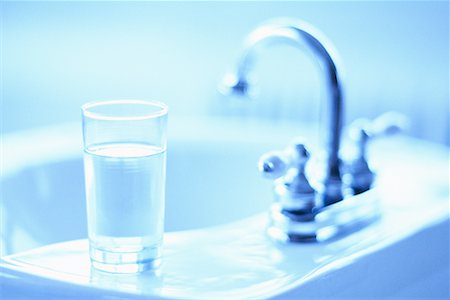 pictures of water glass and faucet - Glass Of Water On Bathroom Sink Stock Photo - Rights-Managed, Code: 700-00151420