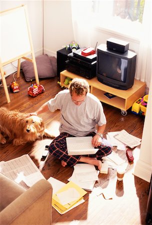 simsearch:700-01183739,k - Man Sitting on the Floor Working On Laptop Stock Photo - Rights-Managed, Code: 700-00151545