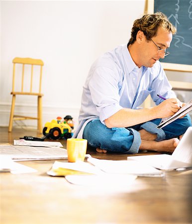 Man Using Laptop and Making Notes at Home Stock Photo - Rights-Managed, Code: 700-00151554