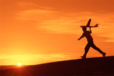 plane silhouette side - Boy With Toy Airplane Stock Photo - Rights-Managed, Code: 700-00151585
