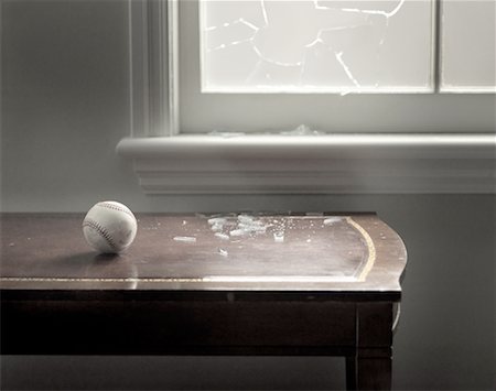 picture baseball breaking glass - Baseball Sitting on Table Near Broken Window Stock Photo - Rights-Managed, Code: 700-00151666