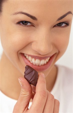 Woman Holding Chocolate Stock Photo - Rights-Managed, Code: 700-00151962