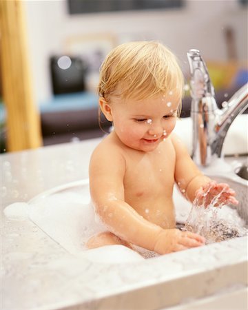 Baby Bathing In Kitchen Sink Stock Photo - Rights-Managed, Code: 700-00152190