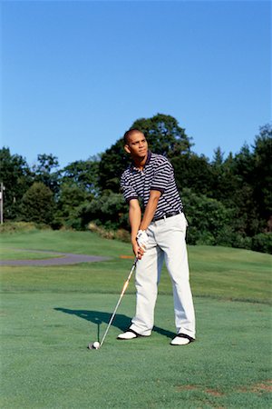 Young Man Golfing Fotografie stock - Rights-Managed, Codice: 700-00152262