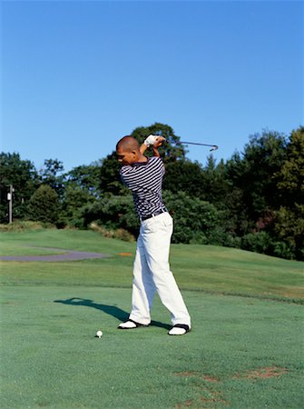 Young Man Golfing Fotografie stock - Rights-Managed, Codice: 700-00152263