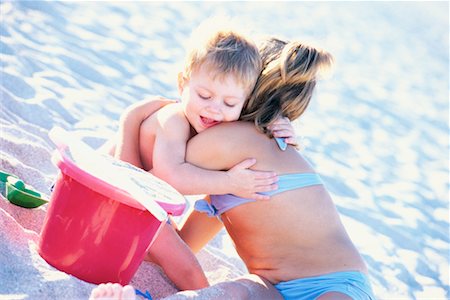 sister hugs baby - Brother and Sister Hugging at The Beach Stock Photo - Rights-Managed, Code: 700-00152412