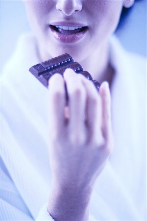Woman Eating Chocolate Stock Photo - Rights-Managed, Code: 700-00152462