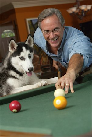 playing pool at a bar - Man Playing Pool with Dog Stock Photo - Rights-Managed, Code: 700-00152698